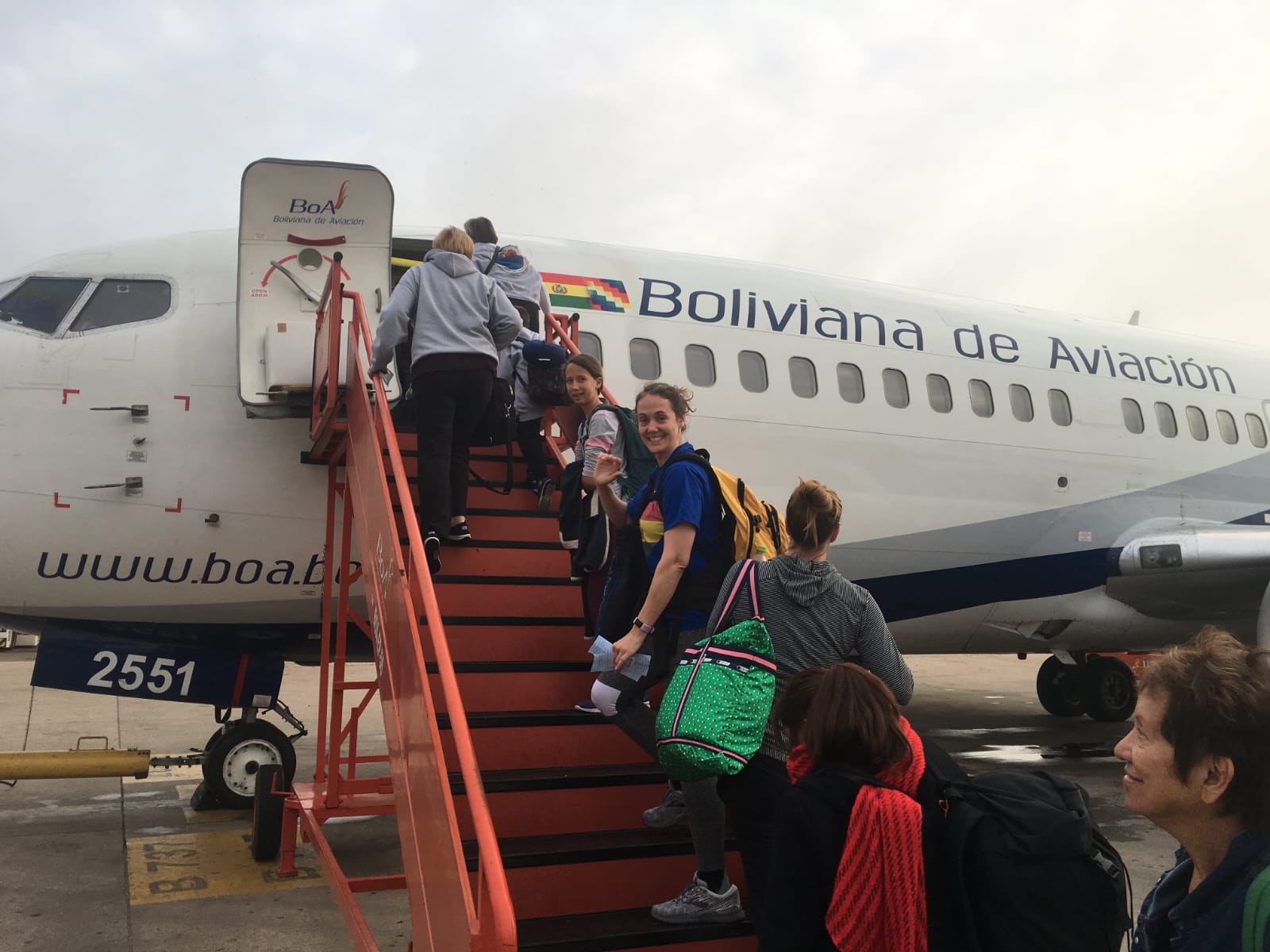 Team boarding flight to volunteer in Bolivia